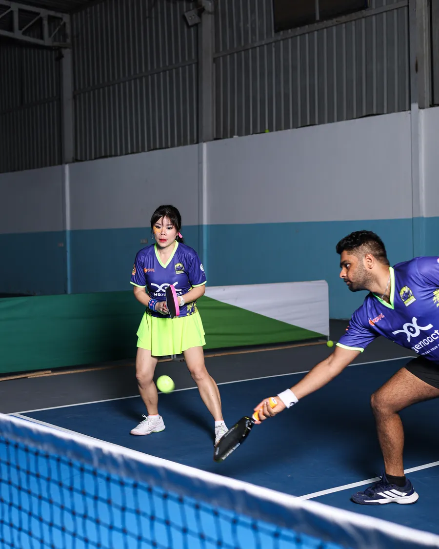Emily Thorn and Sanjay VR playing doubles